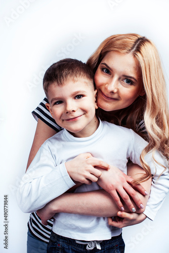 young modern blond mother with cute son together happy smiling family posing cheerful on white background, lifestyle people concept, sister and brother friends