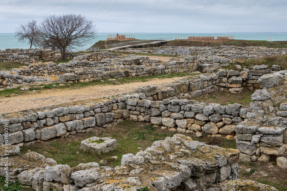 Ruins of the ancient city of Chersonesus on the Black Sea coast. View of the remains of ancient stone buildings and streets. Archaeological sites of the Crimean peninsula. Sevastopol, Crimea.
