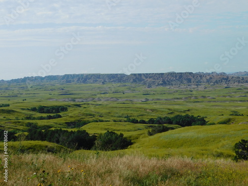 Green fields give way to the dramatic hillsides of the Badlands