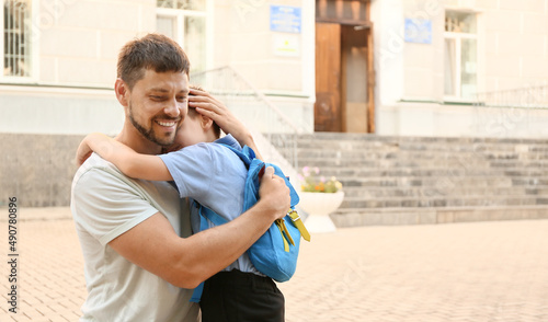 Father hugging his little s...