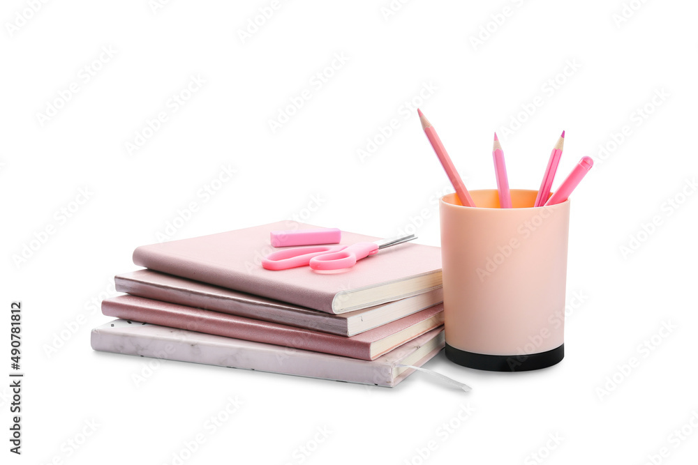 Stack of notebooks, scissors, eraser and pencils on white background Stack of notebooks, scissors, eraser and pencils on white background