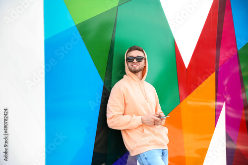 Young guy in stylish hoodie...
