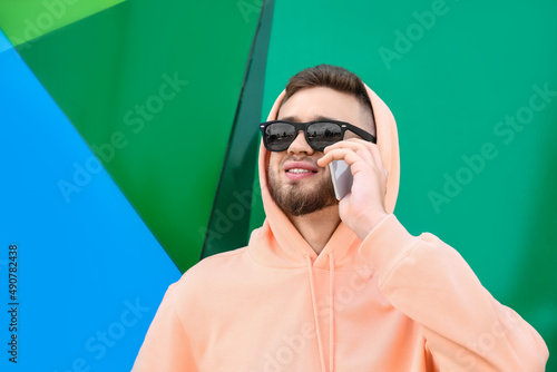 Young guy in stylish hoodie...