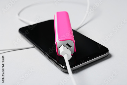 Pink power bank with USB ca...