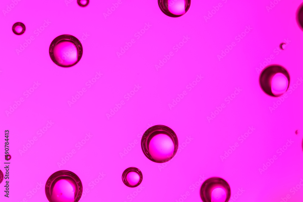 Clear water with bubbles on color background, closeup