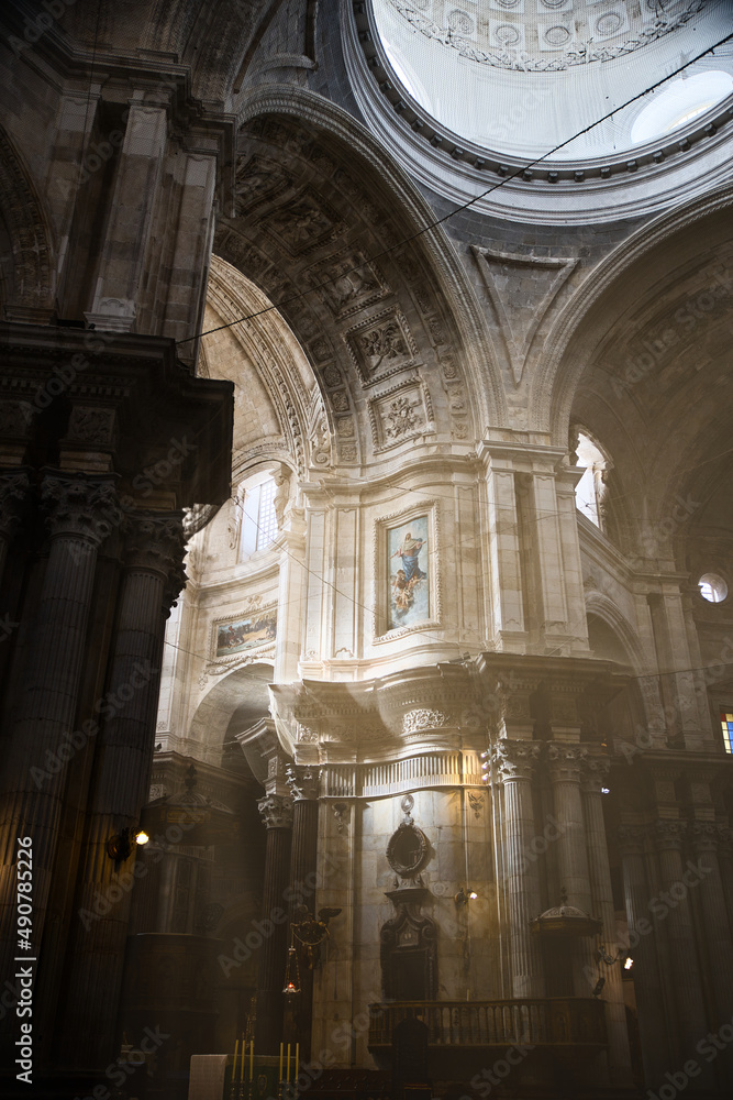 interior of the cathedral of Cadiz with sunbeams entering through the windows