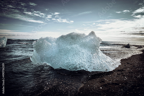 Big ice block on black beach photo