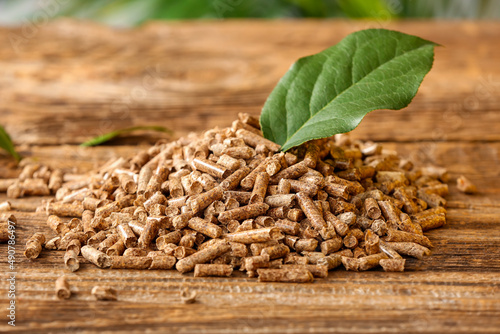Pile of wood pellets on table, closeup © Pixel-Shot