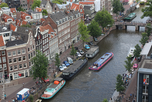 Photography Aerial view of the cityscape with high buildings and Amsterdam canals