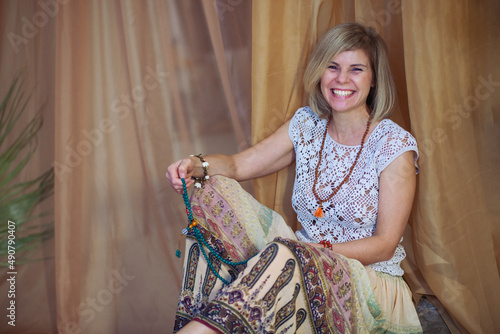 The concept of zen, peace, balance. A woman sits and meditates  using Mudra, keeping her legs crossed