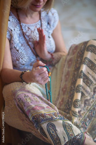 The concept of zen, peace, balance. A woman sits and meditates  using Mudra, keeping her legs crossed
