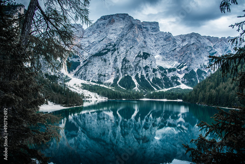 Scenic view of Lake Braies in front of an alpine mountain in Prags Dolomites in South Tyrol, Italy photo