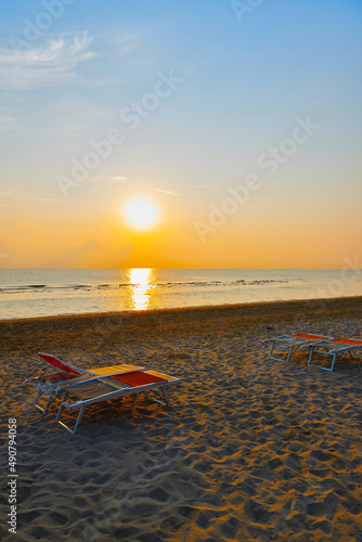 Fototapeta Naklejka Na Ścianę i Meble -  Sunbeds on the beach of Rimini in Italy	
