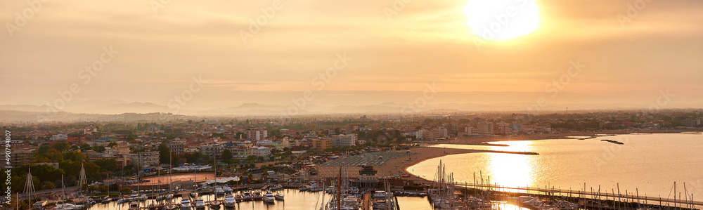 Aerial view of Rimini sea port with ships and blue water. 