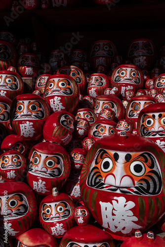 Vertical shot of Japanese traditional dolls Daruma photo