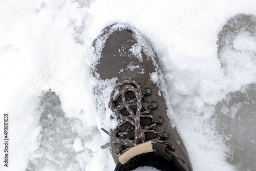 Close-up of winter boots in the snow.