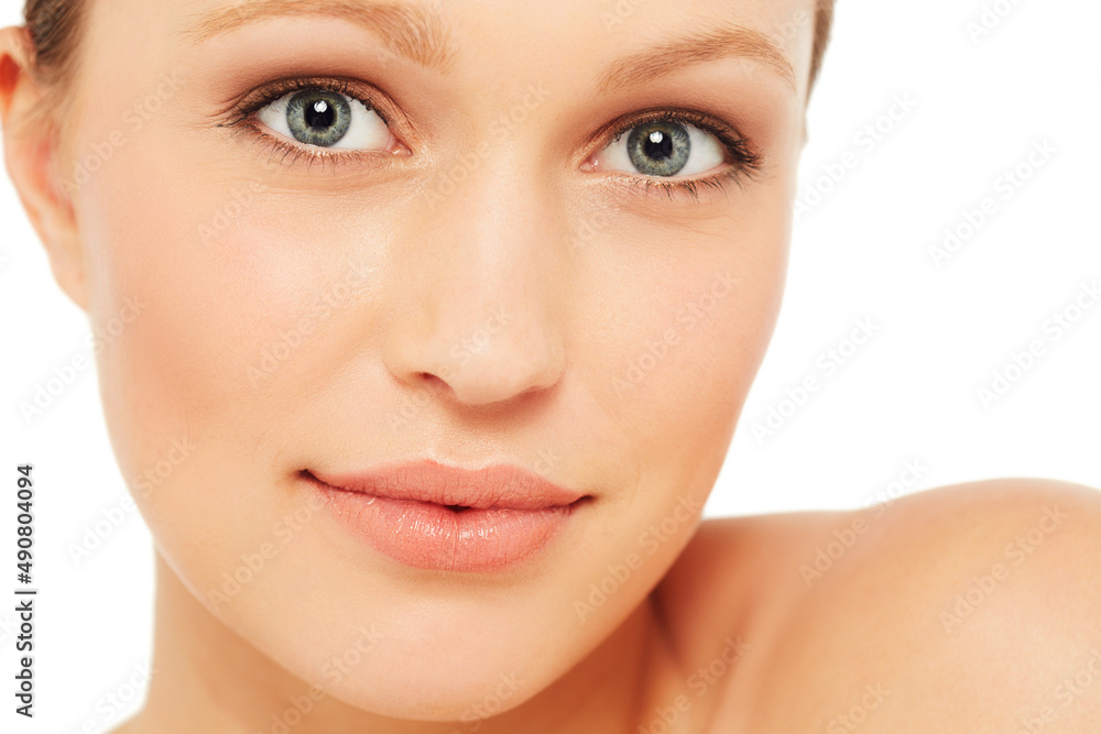 Shes got that feminine look about her. Beauty shot of a young woman against a white background. Shes got that feminine look about her. Beauty shot of a young woman against a white background.