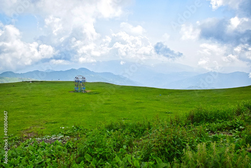 Scenic view of the green Tolipeer Meadows on the background of mountains, Pakistan photo