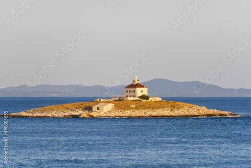 Lighthouse on the small island in Adriatic Sea, near town Hvar. Island Hvar, Croatia.