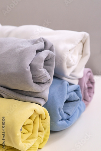 Colorful clothes on the shelf. sweatshirt. hoodies
