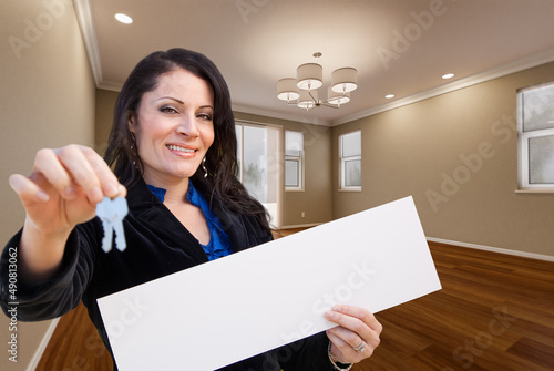 Hispanic Woman With House K...