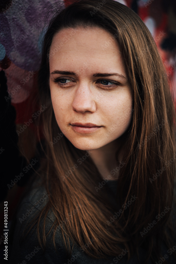 Close up shot of young woman with a beautiful face - street style photography Close up shot of young woman with a beautiful face - street style photography