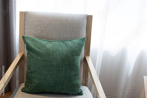 Green pillows in  chair,  Curtains background photo