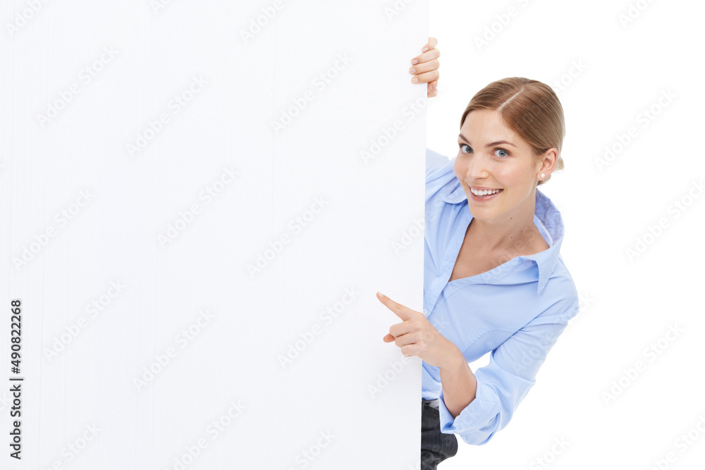 Watch this space. Studio shot of a beautiful young businesswoman pointing towards your copyspace on a blank white wall. Watch this space. Studio shot of a beautiful young businesswoman pointing towards your copyspace on a blank white wall.
