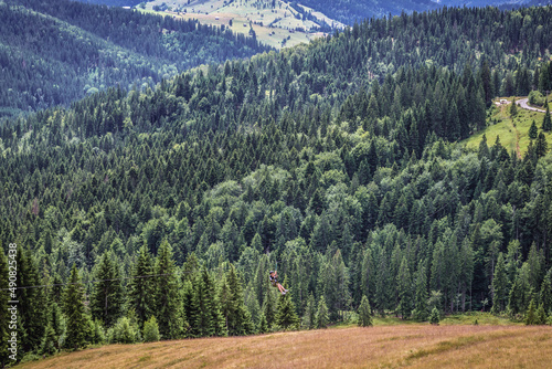 Zip line on Ciumarna Pass also called Palma Pass, Moldavian-Muntenian Carpathians, Romania photo