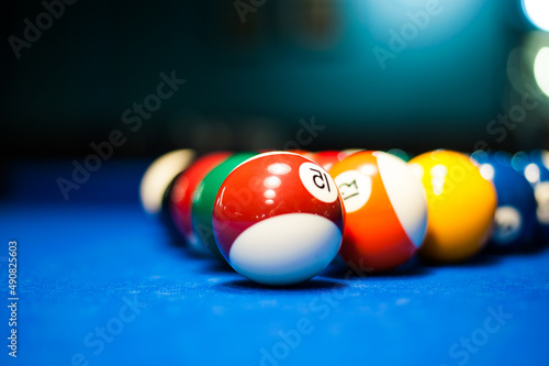 yellow billiard ball number one is on the blue table at the pocket