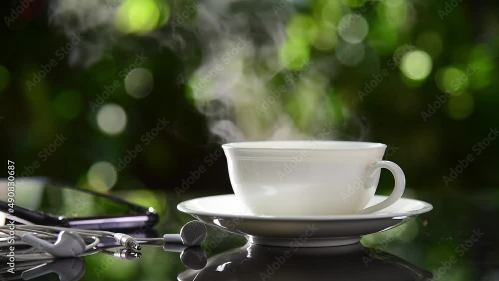cup of coffee on the table green garden bokeh background cup of coffee on the table green garden bokeh background