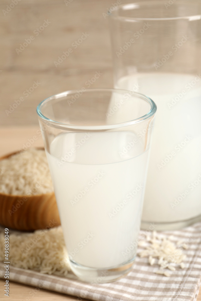 Natural rice water and grains on table, closeup Natural rice water and grains on table, closeup