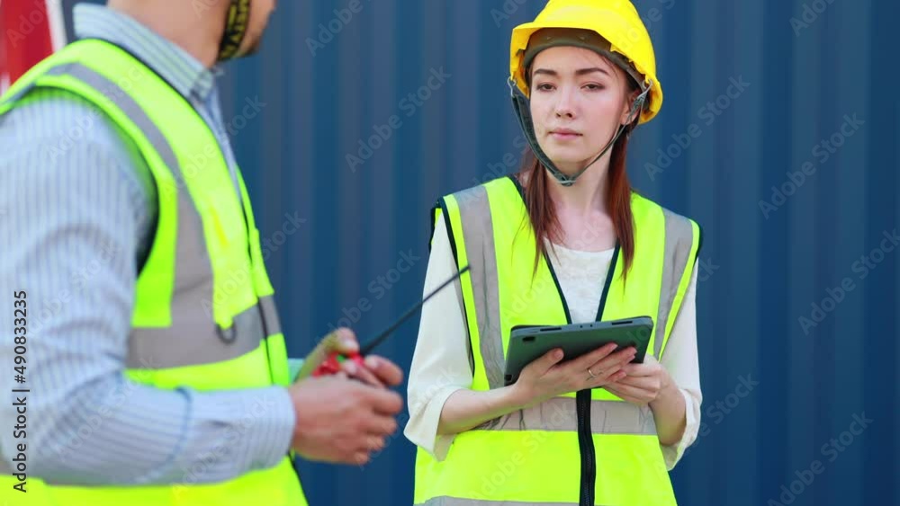 Caucasian Man manager and woman Supervisor dock cargo handshaking after good deal at container yard port of import and export goods. Unity and teamwork concept Caucasian Man manager and woman Supervisor dock cargo handshaking after good deal at container yard port of import and export goods. Unity and teamwork concept
