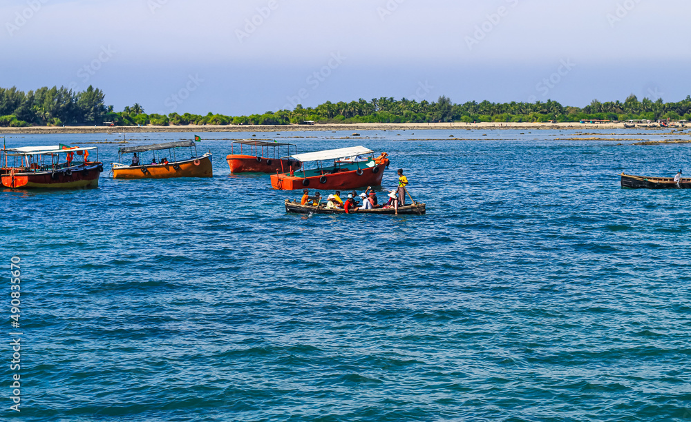 Tourist jetty of St. Martin's Island, Bangladesh. Photo of a seaport on an island with many ships docked. Good to use for outdoor and something about facilities or transporter content.