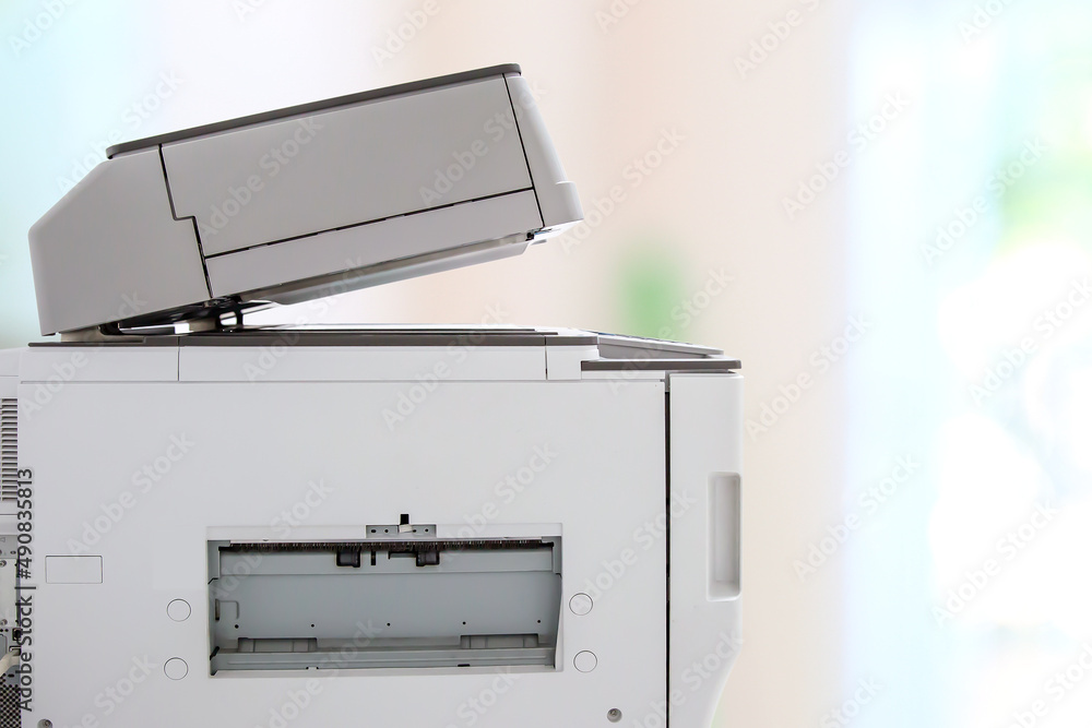 Copier printer, Close up the photocopier or photocopy machine office equipment workplace for scanner or scanning document and printing or copy paper duplicate and Xerox. Copier printer, Close up the photocopier or photocopy machine office equipment workplace for scanner or scanning document and printing or copy paper duplicate and Xerox.