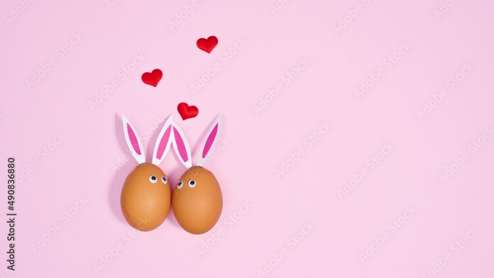 Easter rabbit eggs in love. Creative copy space stop motion. Flat lay Easter rabbit eggs in love. Creative copy space stop motion. Flat lay