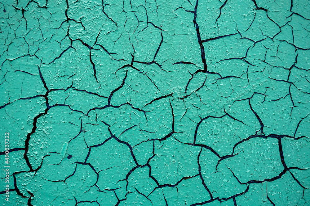 Obraz premium Cracked and damaged painted surface of a building or wall. Texture, aged paint background
