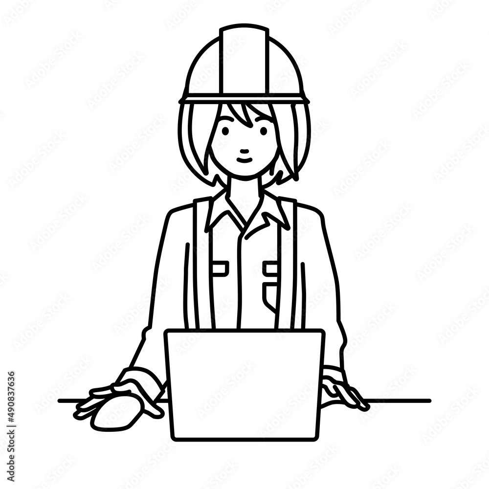 デスクで座ってPCを使っている工事現場の女性