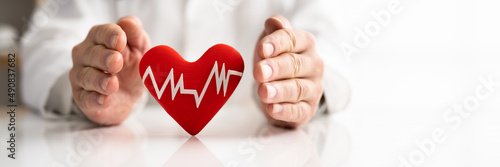 Doctor Protecting Heart With Heartbeat Pulse Icon