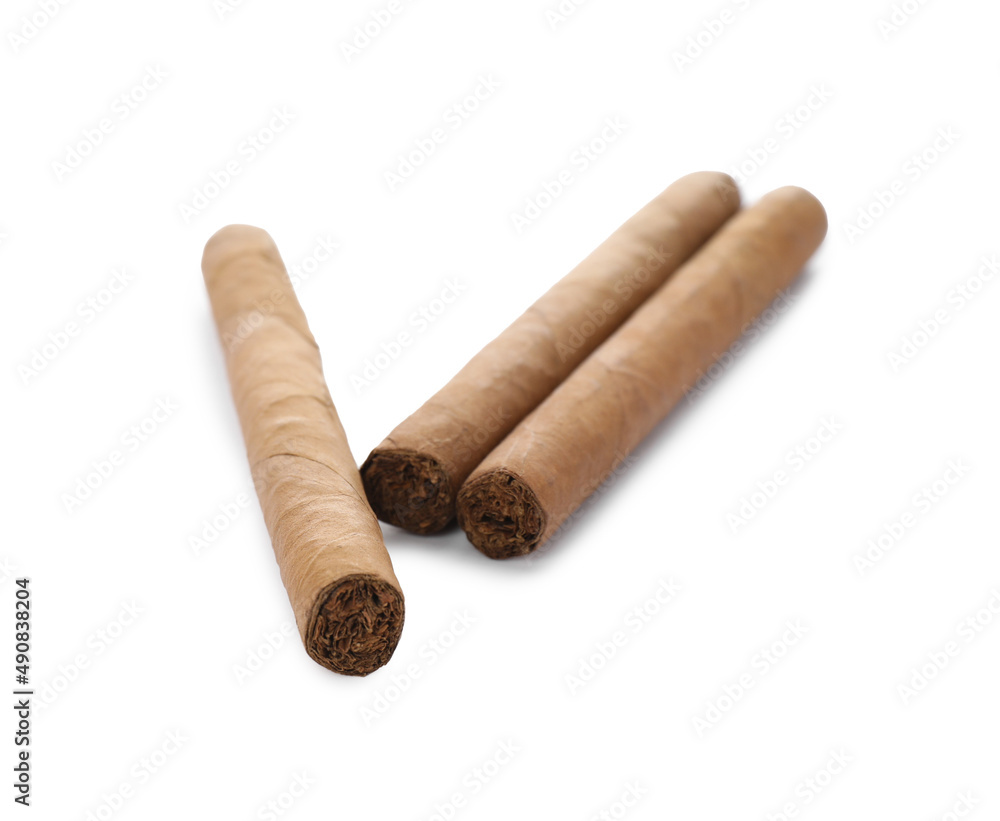 Cigars wrapped in tobacco leaves on white background Cigars wrapped in tobacco leaves on white background