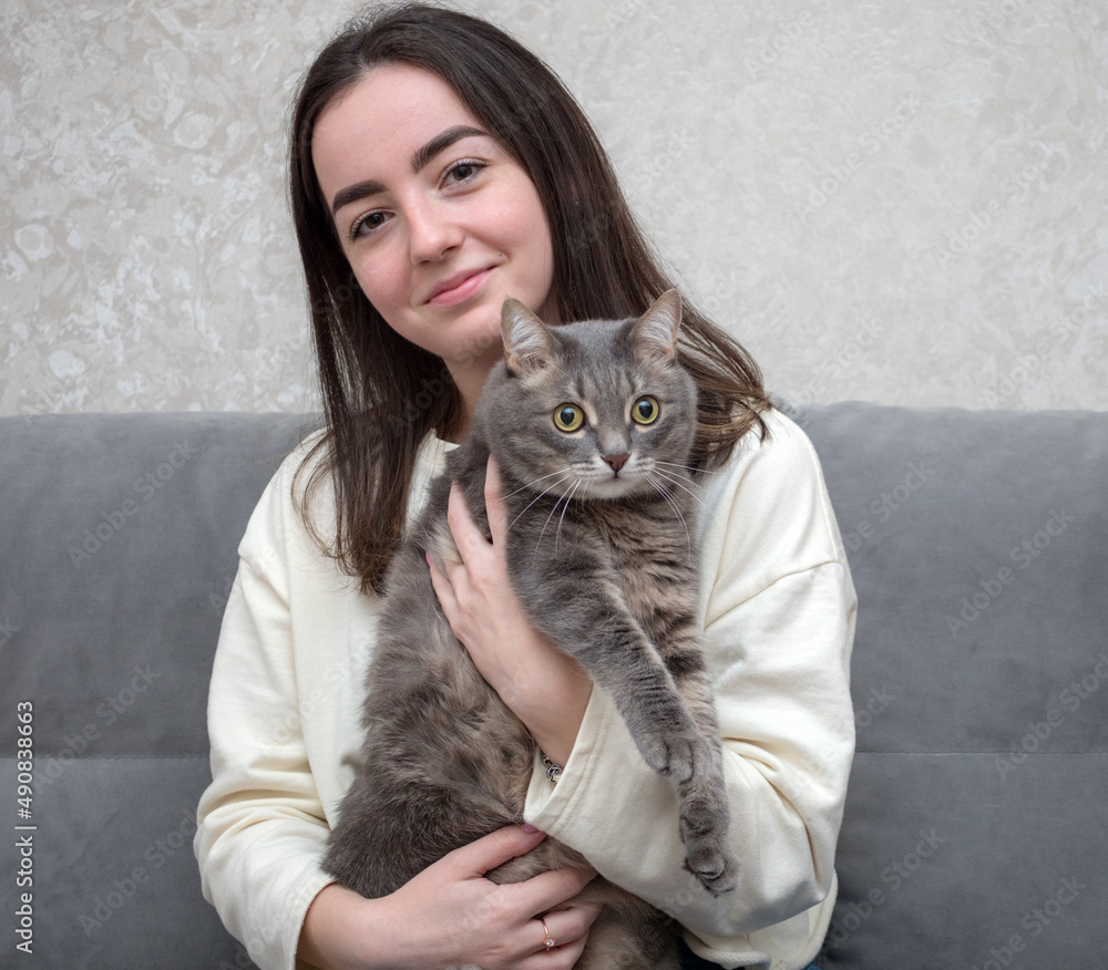 girl with a gray domestic cat