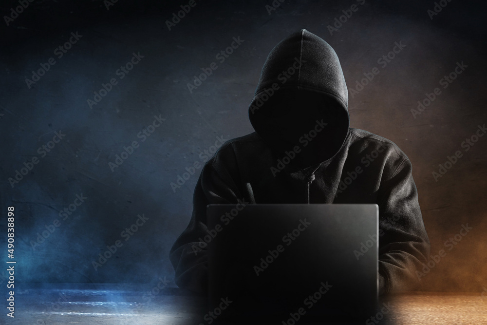 Hacker in hoodie dark theme Stock Photo | Adobe Stock