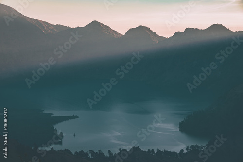 Sunset at Rinjani basecamp and the cloud over Segara Anak lake. © loliloop