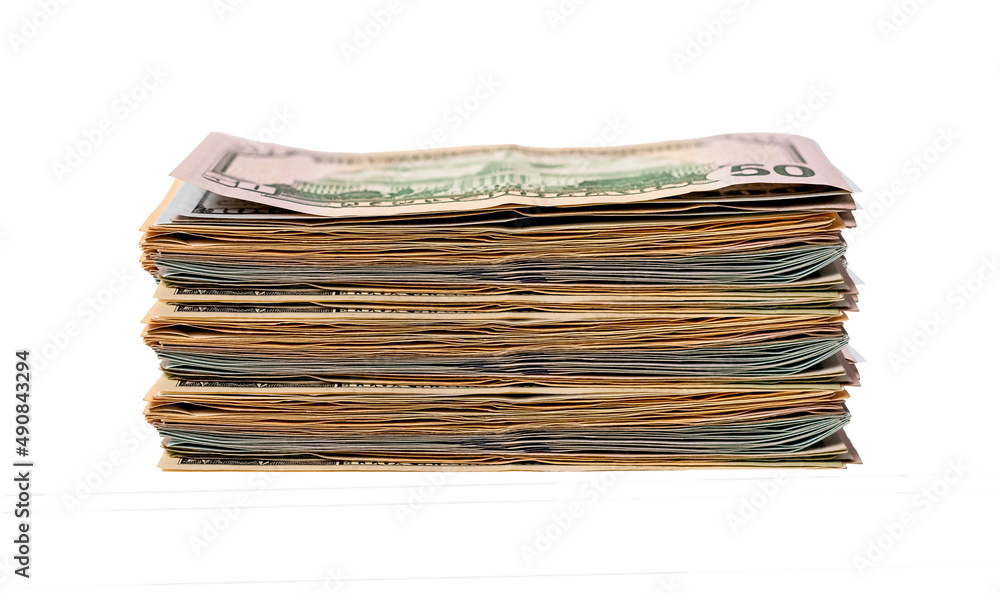Large dollar bills stack isolated on white background. Money and finance concept. Wages or savings in cash. High quality photo Large dollar bills stack isolated on white background. Money and finance concept. Wages or savings in cash. High quality photo