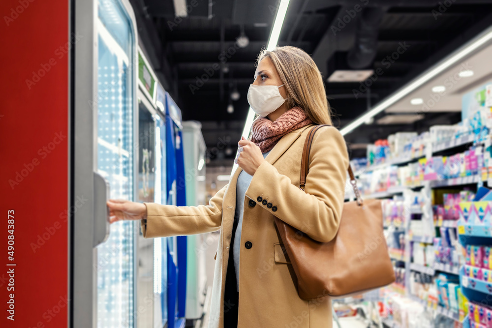 Customers in a supermarket during a covid outbreak. Customers in a supermarket during a covid outbreak.