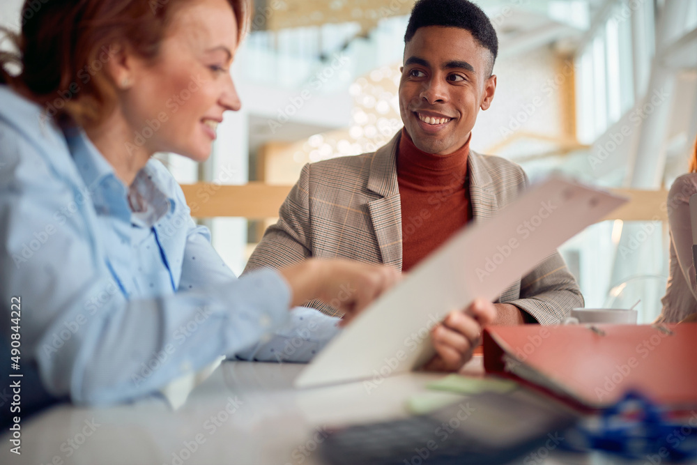man laughing at funny joke with diverse coworkers. man laughing at funny joke with diverse coworkers.