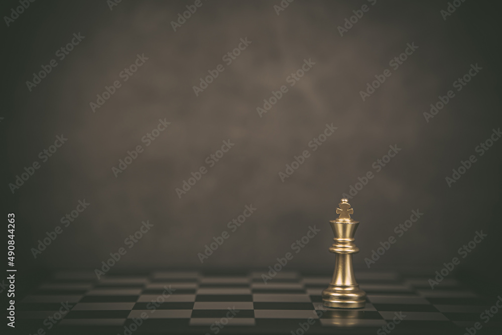 King chess stand on chessboard concept of team player or business team and leadership strategy and human resources organization management or goal to win or strong winner.