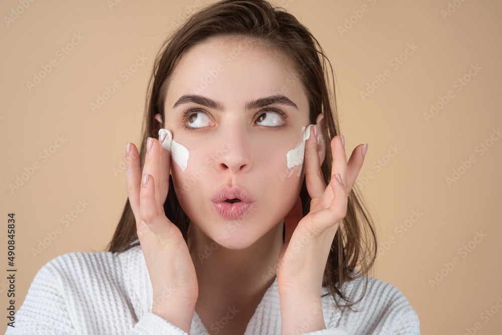 Woman facial mask, face clay. Beautiful funny woman with cosmetic facial procedure, spa skin concept. Skin care beauty treatment. Cosmetology and spa. Woman facial mask, face clay. Beautiful funny woman with cosmetic facial procedure, spa skin concept. Skin care beauty treatment. Cosmetology and spa.