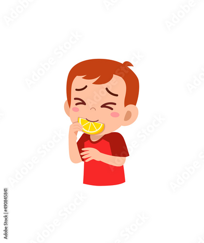 little boy eat sour lemon and show funny expression