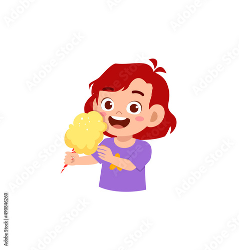 little girl eat sweet cotton candy and feel happy